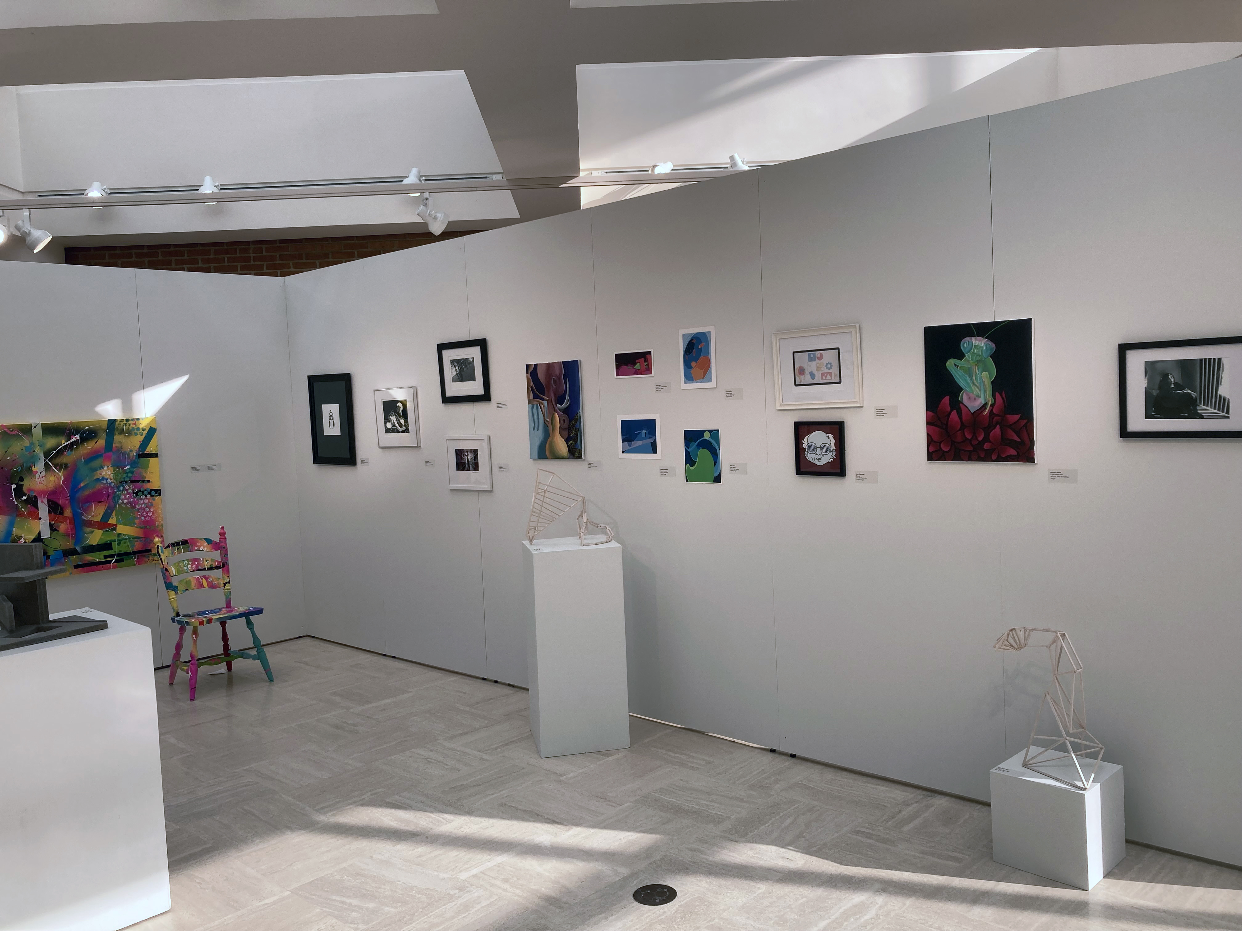 17th Annual Art Student Exhibit inside front of back wall. Various art works shown